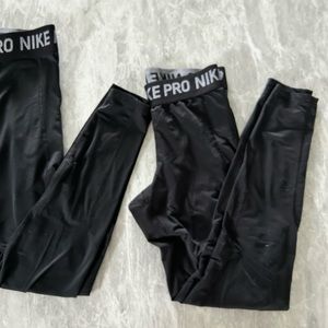 Two black Nike Pro leggings - small